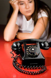 Girl waiting for the phone to ring